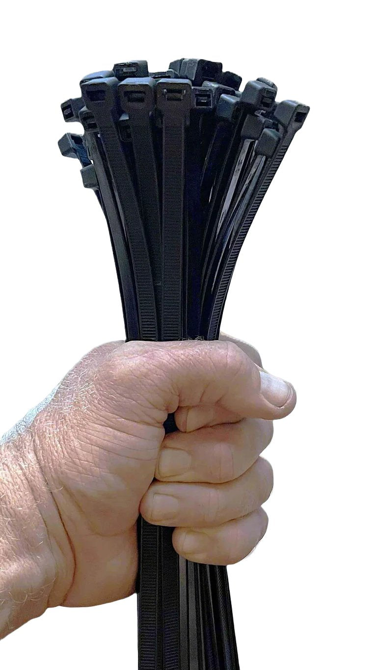 A strong hand gripping a bundle of 12-inch 120lb black zip ties, showcasing their durable and secure grip for heavy-duty applications.