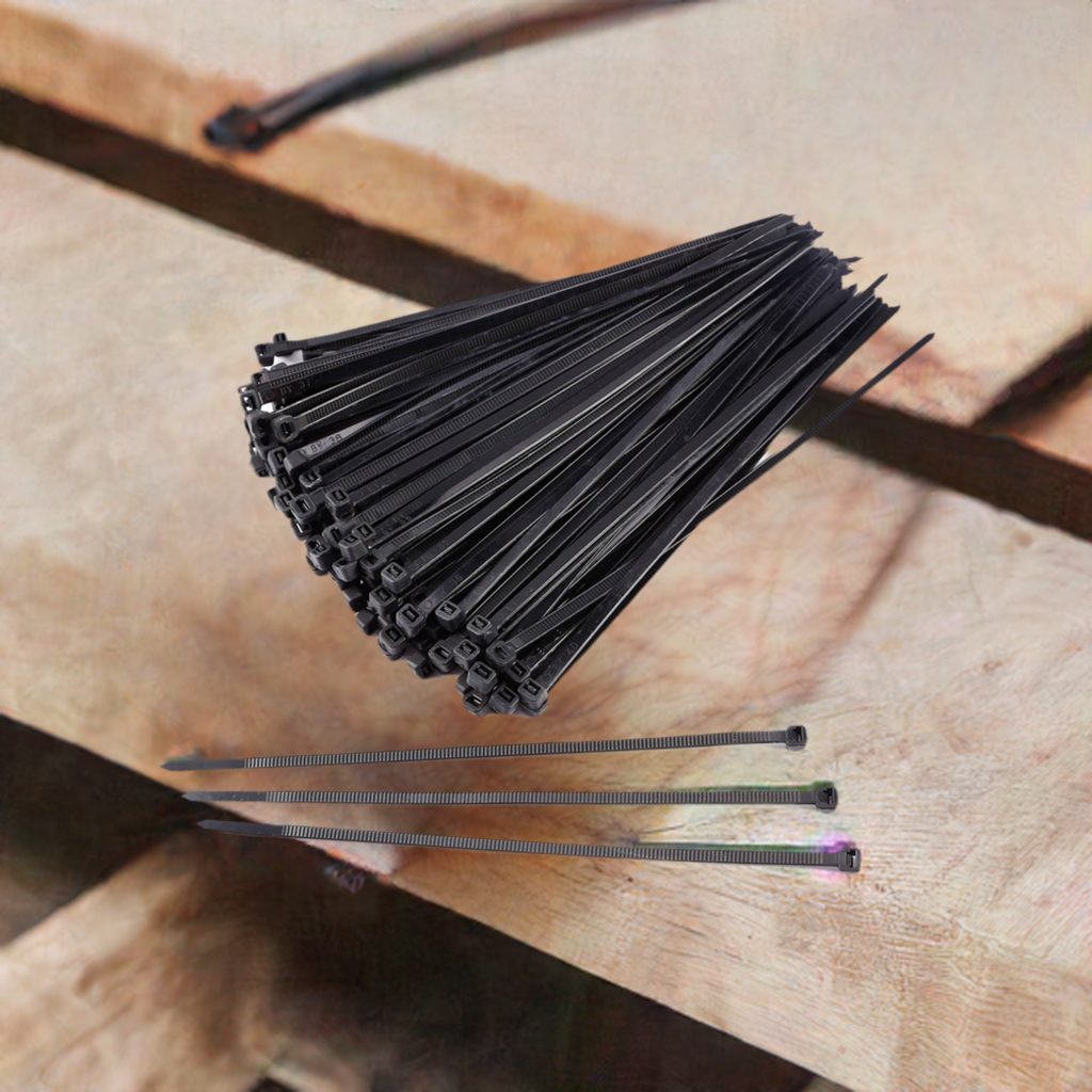 500-pack of 4-inch black heavy-duty zip ties on a wooden surface, showcasing their versatility and UV resistance for various applications.