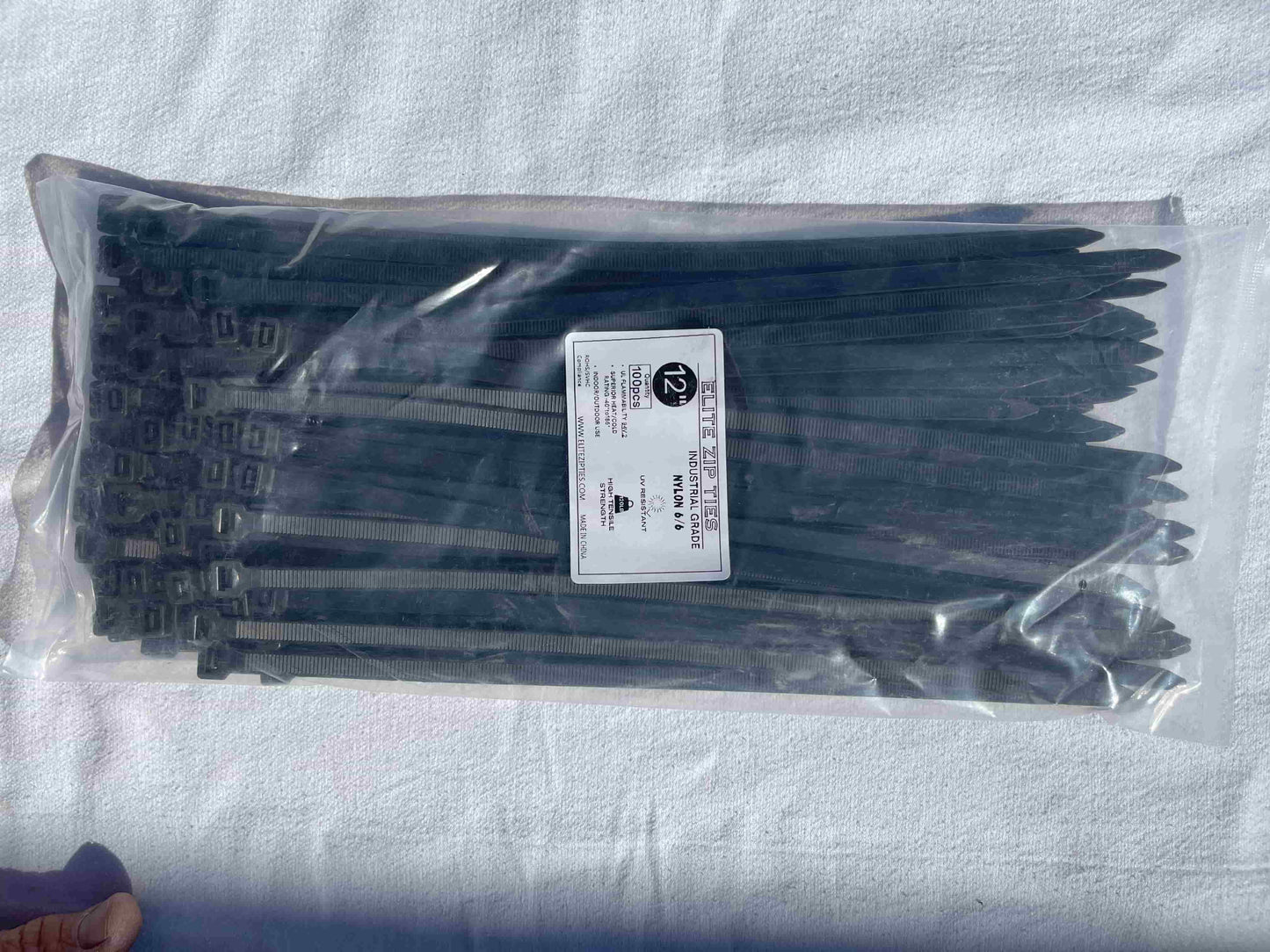 High-quality Nylon 6/6 black zip ties in durable bulk packaging for industrial applications.