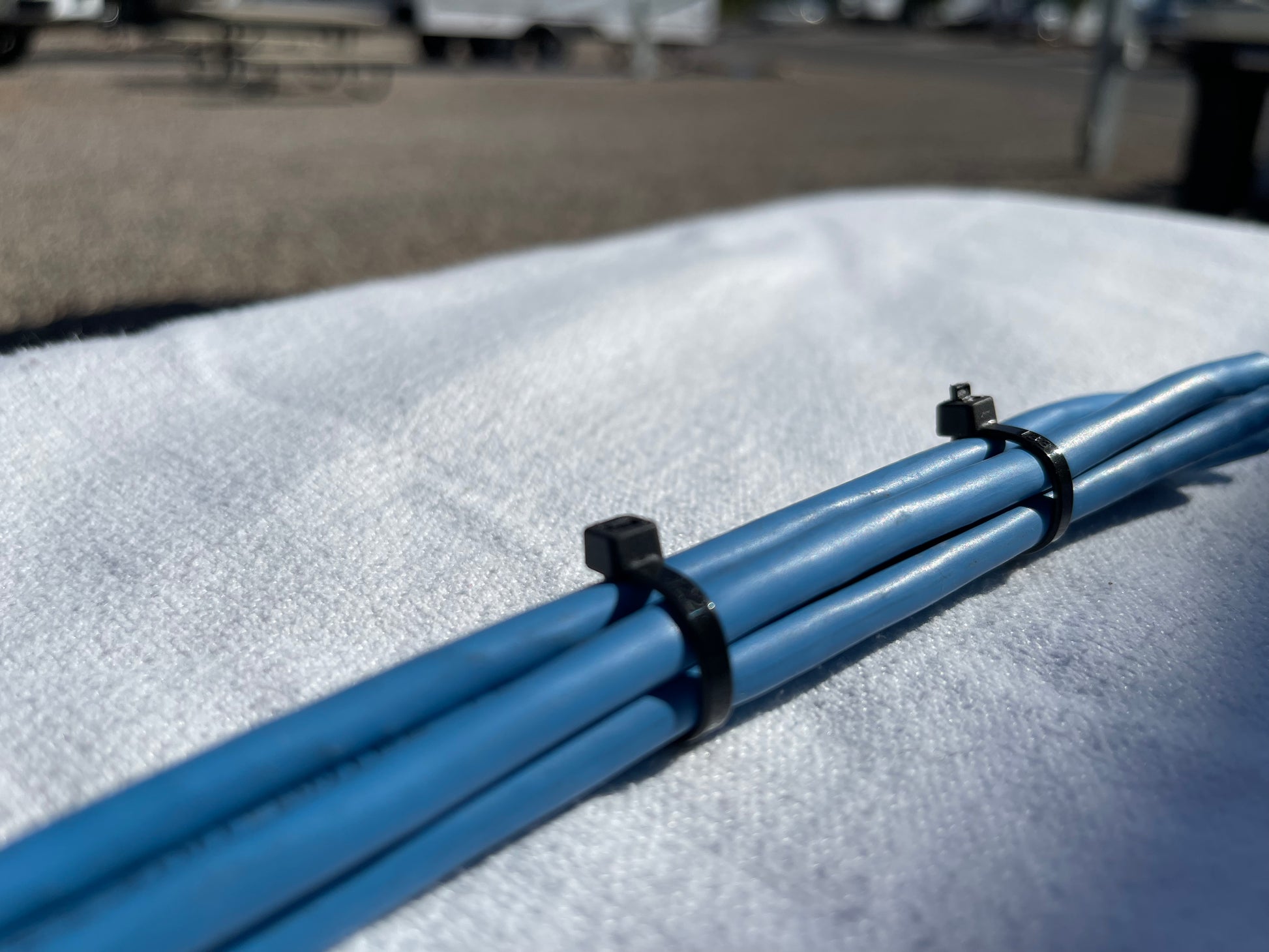 Elite zip ties securing pipes, demonstrating durability and versatility in industrial use.